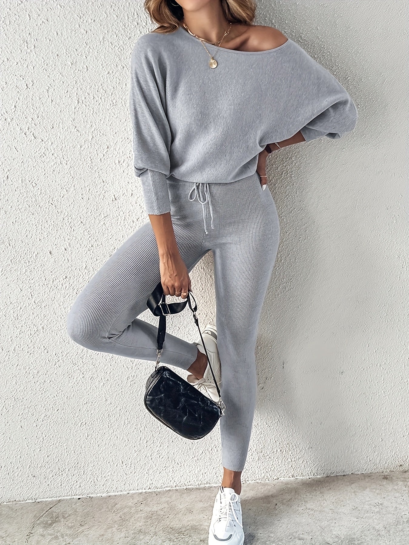 Casual Two-Piece Outfit Featuring A Long-Sleeve Pullover And High-Waisted Drawstring Pants 