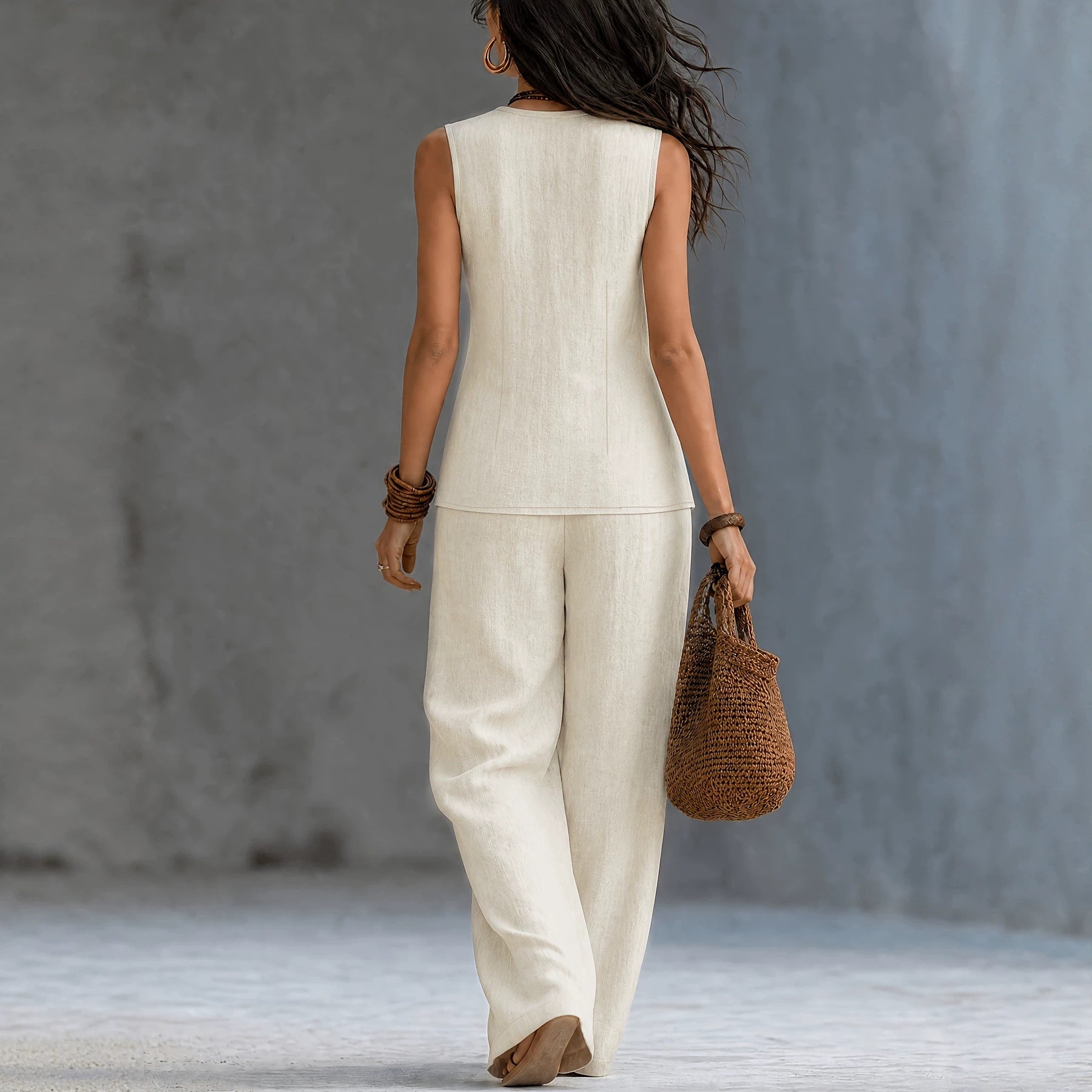 Sleeveless V-neck waist cinched top paired with wide leg pants set 