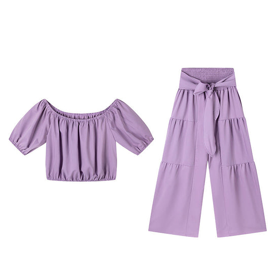 High-waisted Solid-color Flared Pants With Tie Detailing And A Flowing Drape 