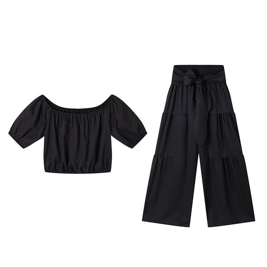 High-waisted Solid-color Flared Pants With Tie Detailing And A Flowing Drape 