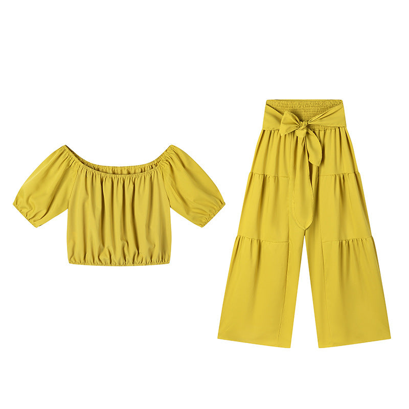High-waisted Solid-color Flared Pants With Tie Detailing And A Flowing Drape 